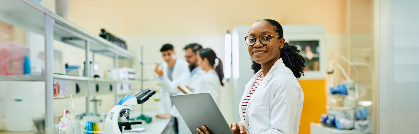 medical students in a lab with a professor